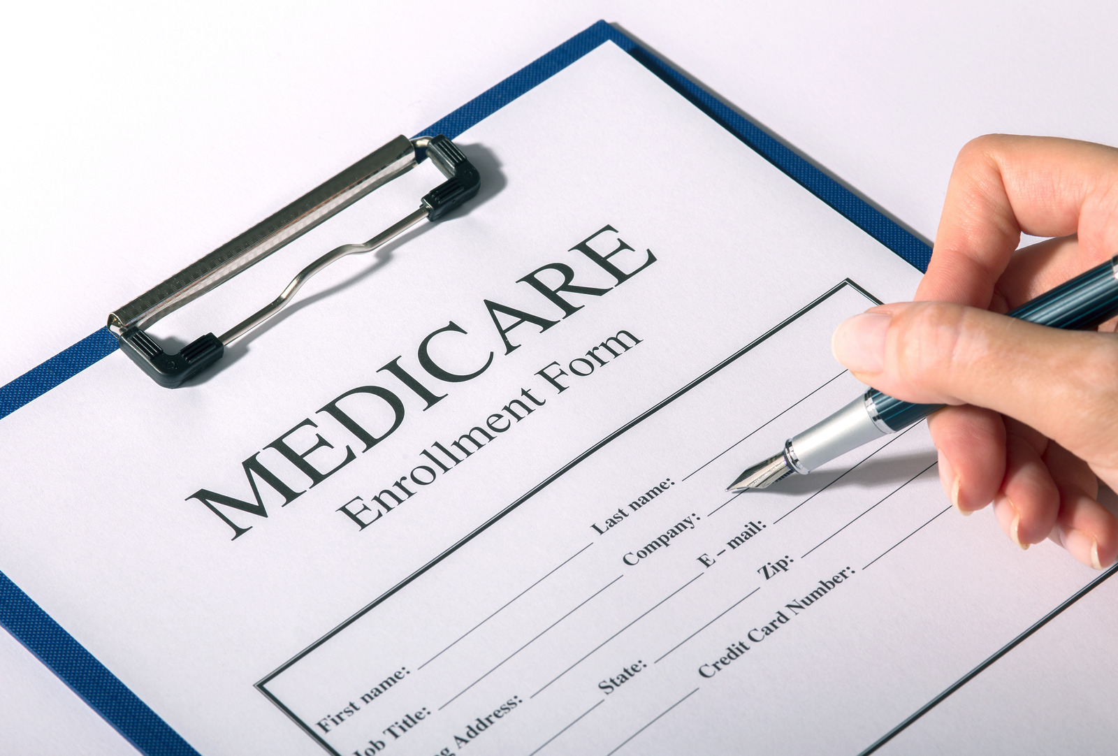 Medicare enrollment form and pen I Sharanda Strong Henry I Strong Loving Life I Insurance Broker in New Orleans Louisiana I Insurance Broker Near Me I Insurance New Orleans I Insurance Louisiana