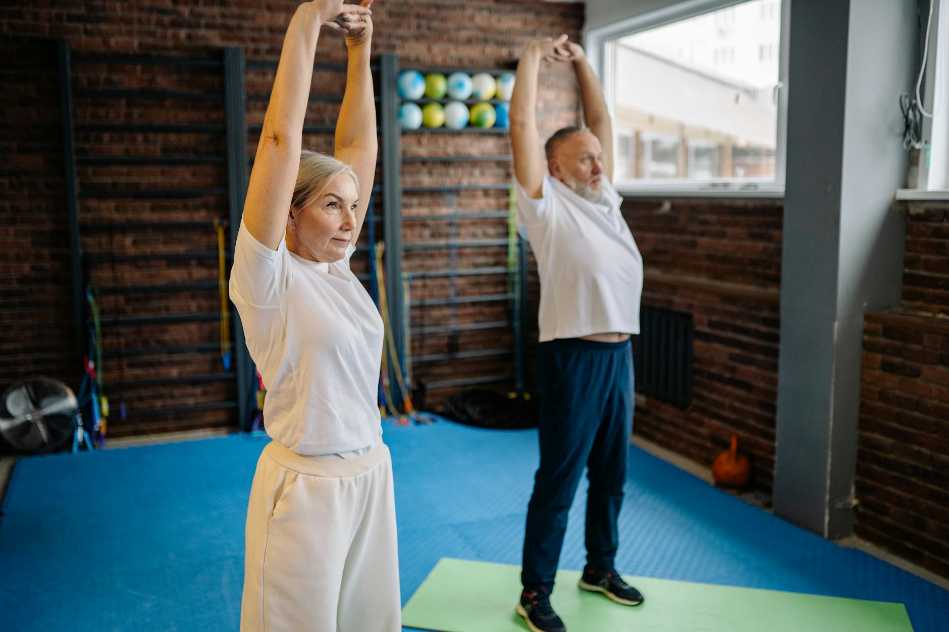 a couple doing stretch exercise together
