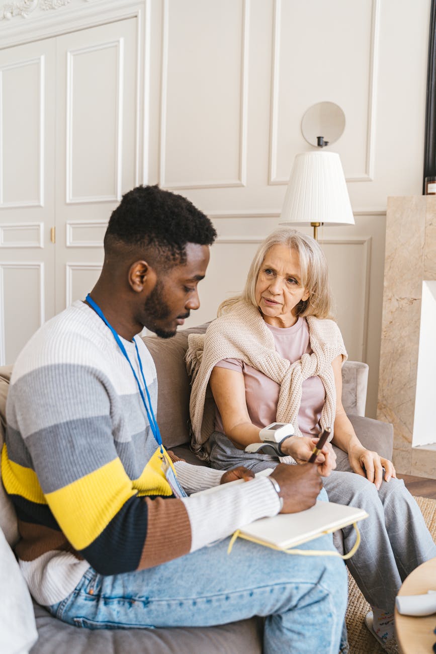 man and woman sitting on the couch