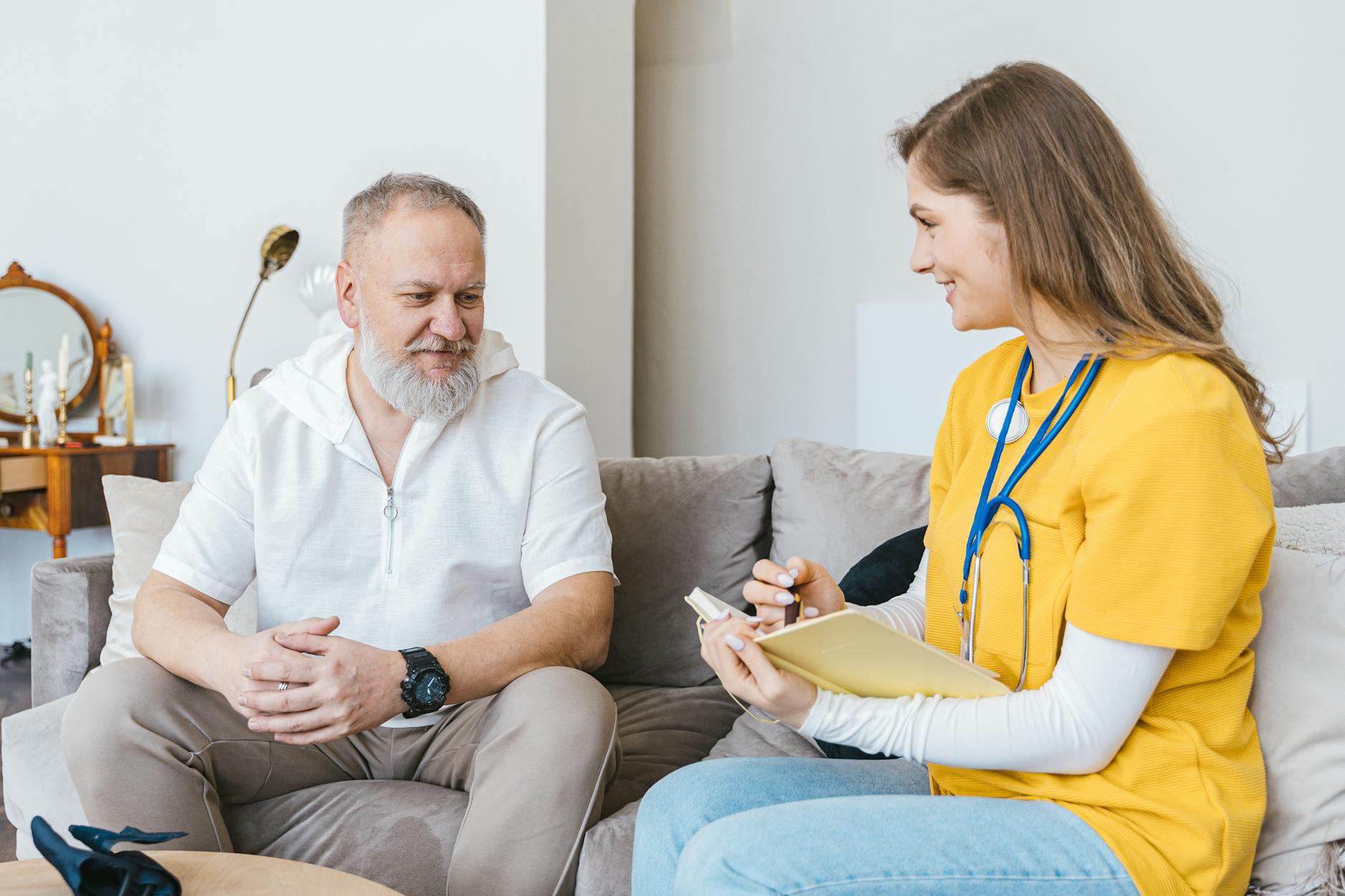 man and woman sitting on the couch
