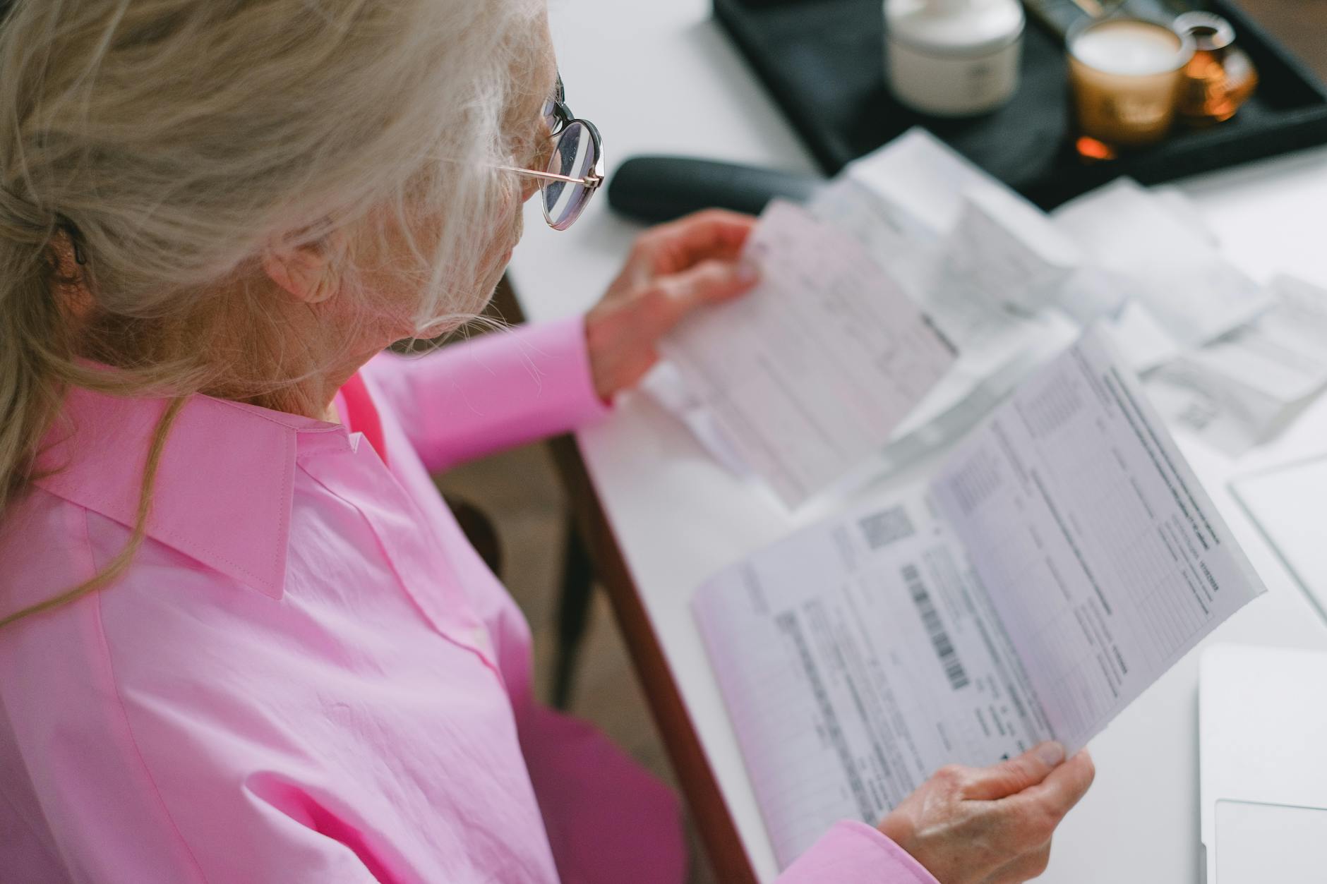 elderly woman reading a document