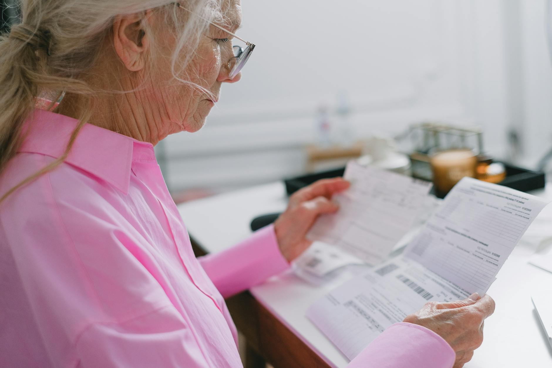 elderly woman reading a document
