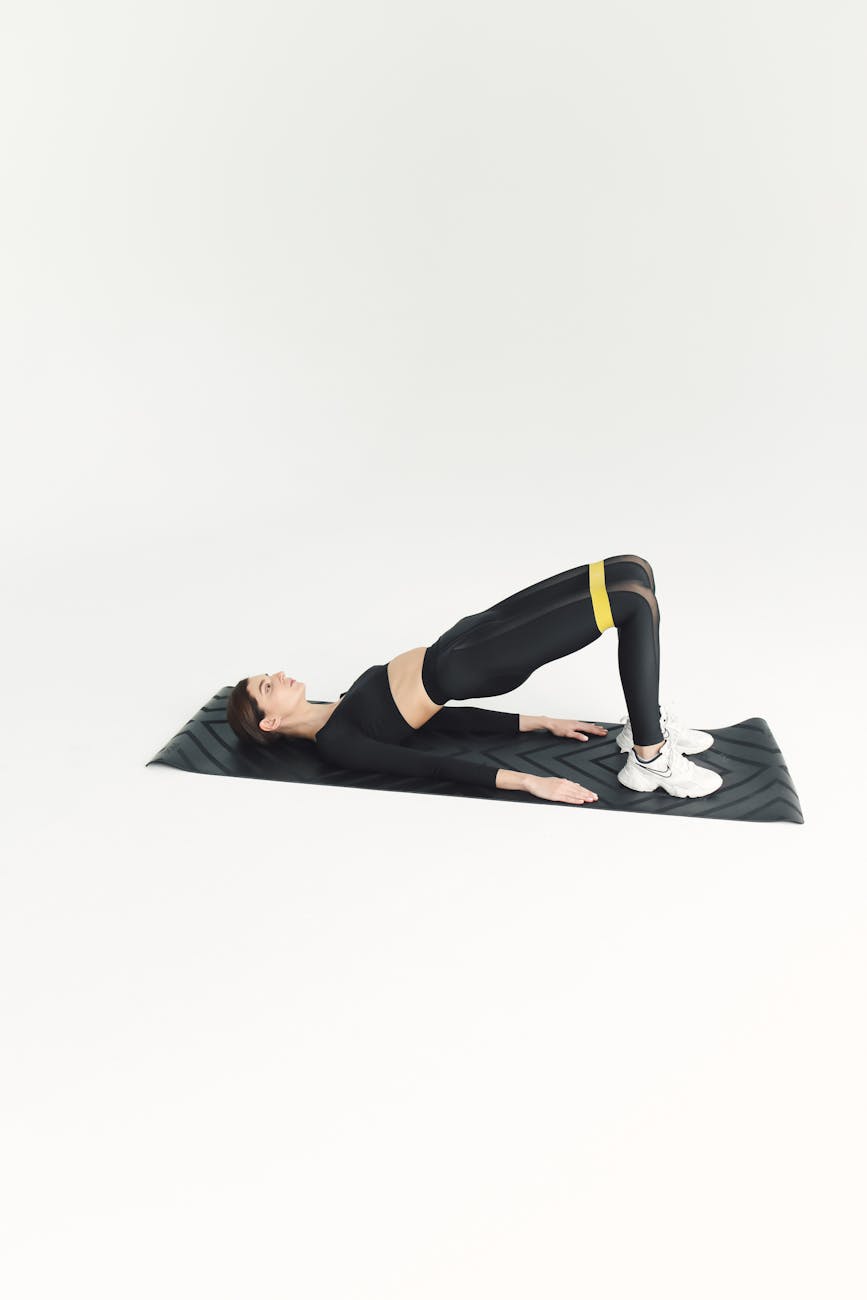a woman working out on an exercise mat