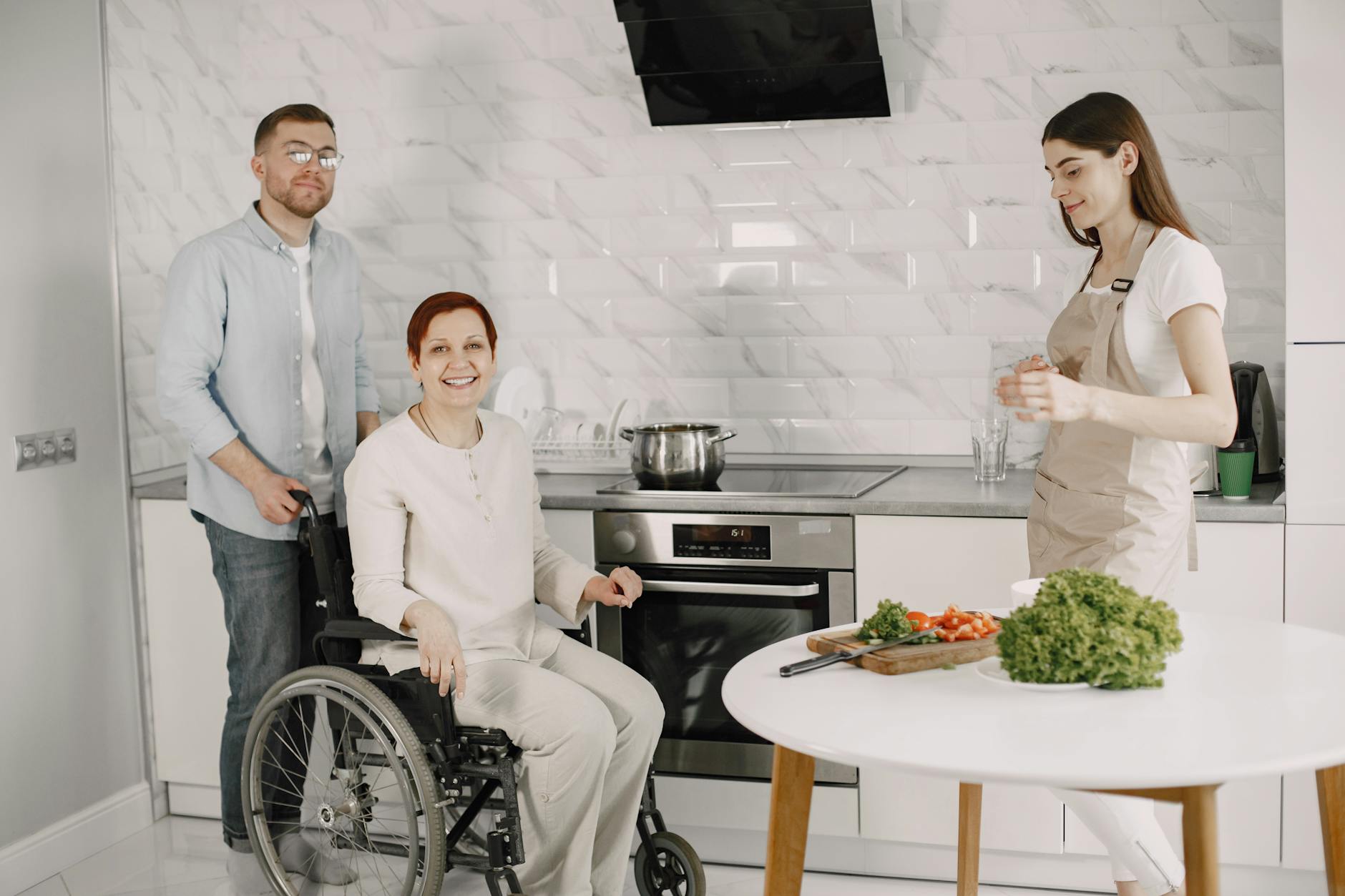 a happy family in the kitchen smiling at the camera