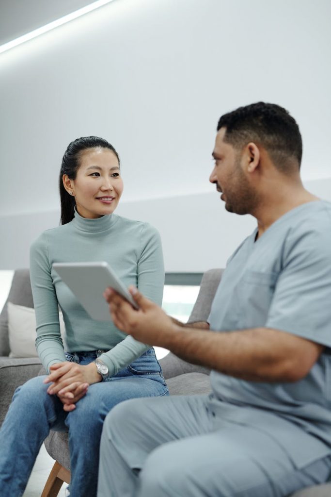 a woman talking to a doctor