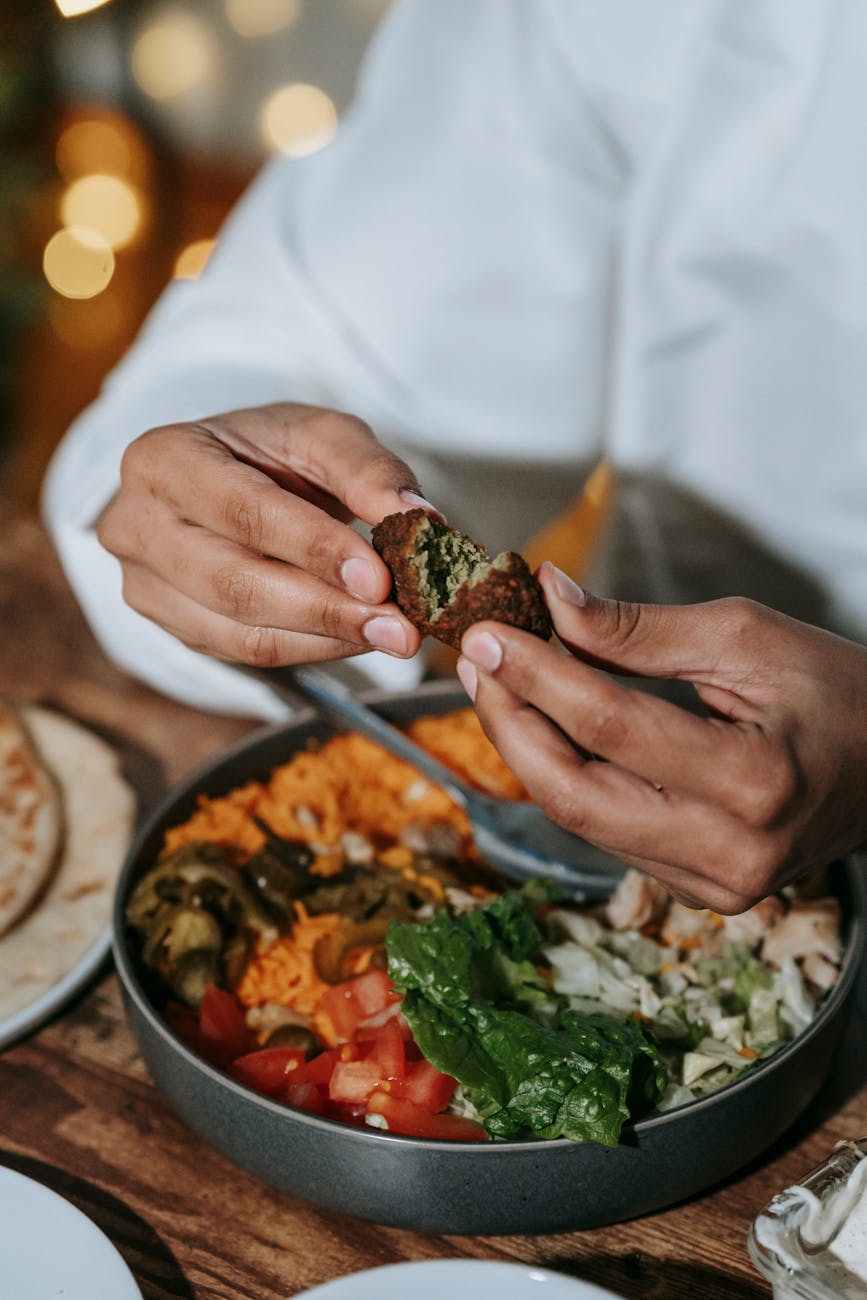 man eating falafel