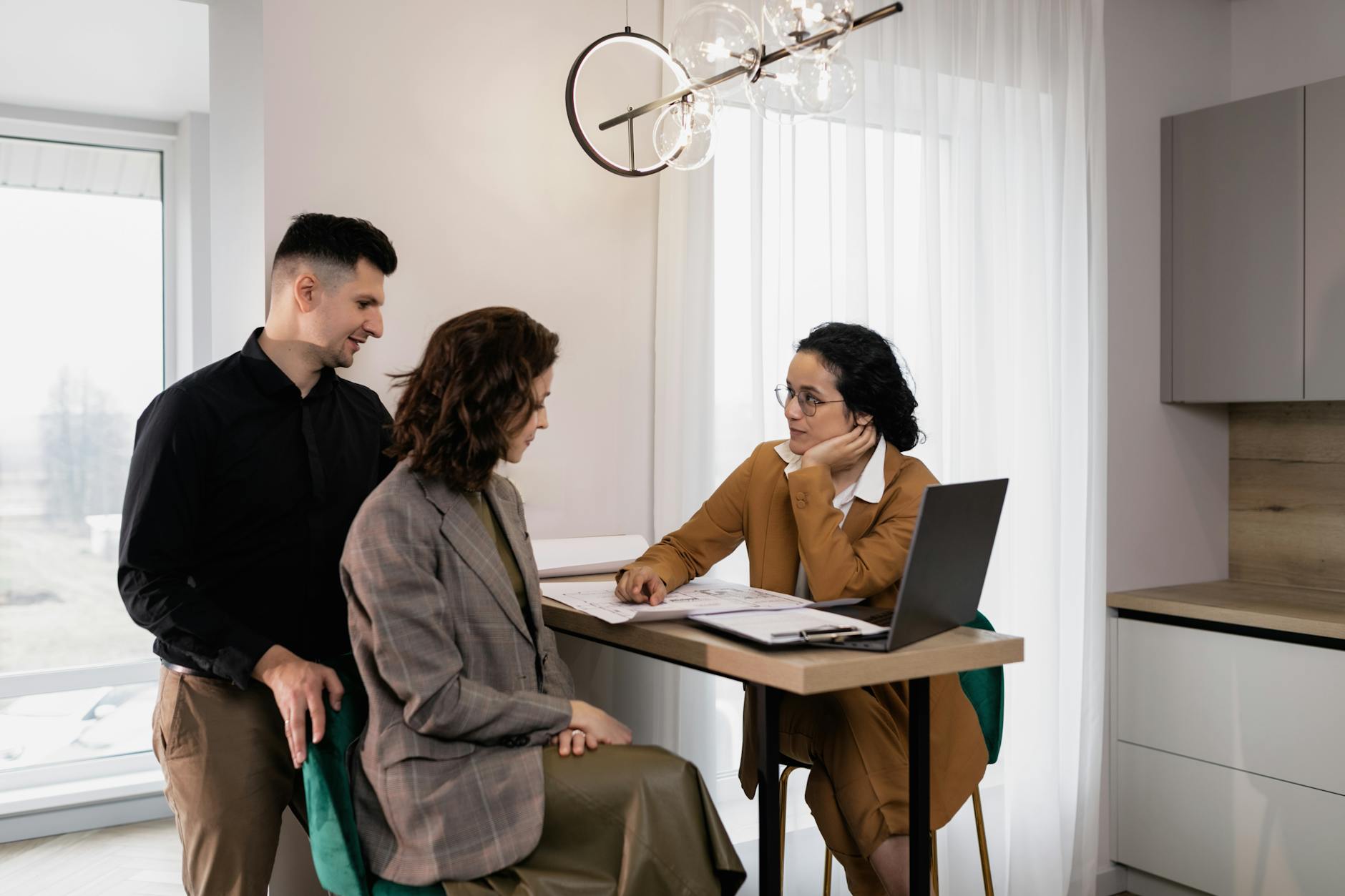 a woman having a discussion with a couple