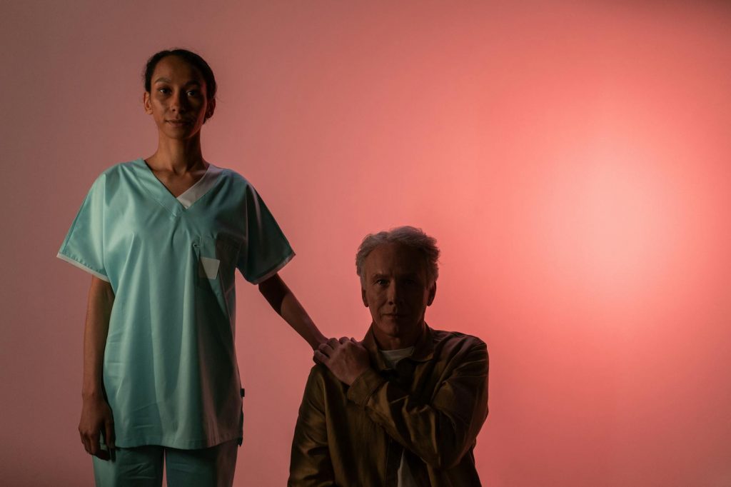 a woman holding a man s shoulder