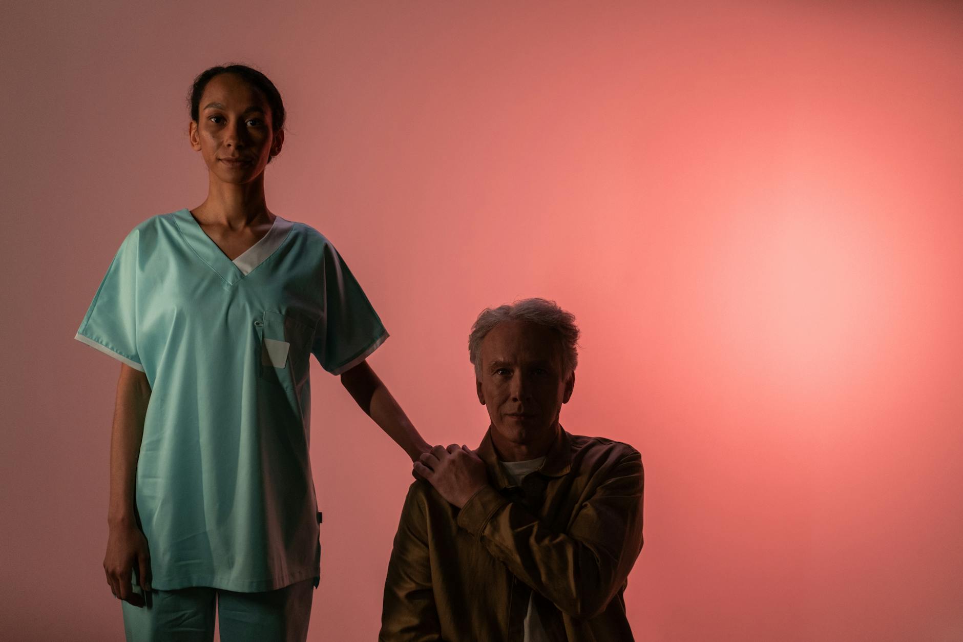 a woman holding a man s shoulder