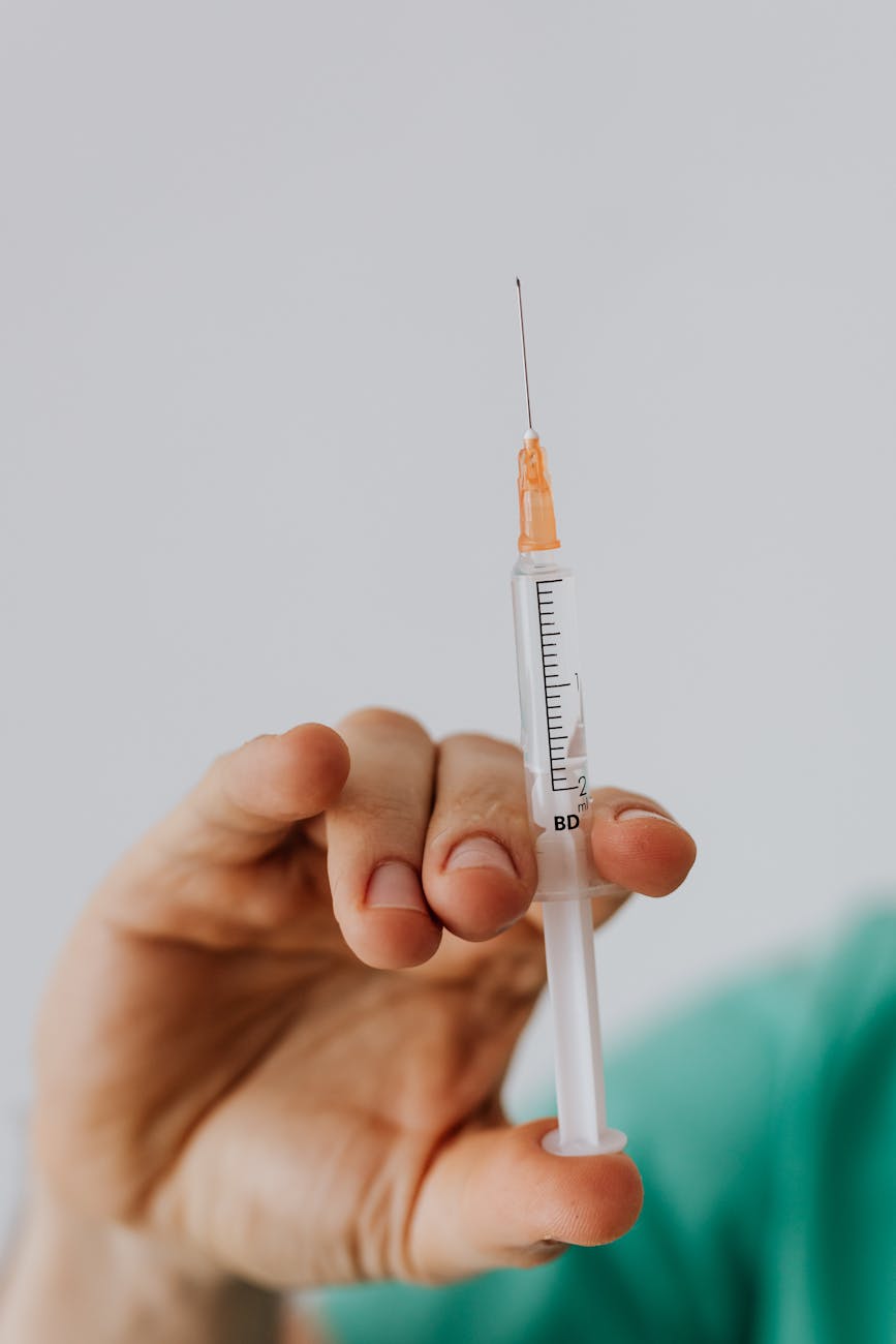 person holding a vaccine