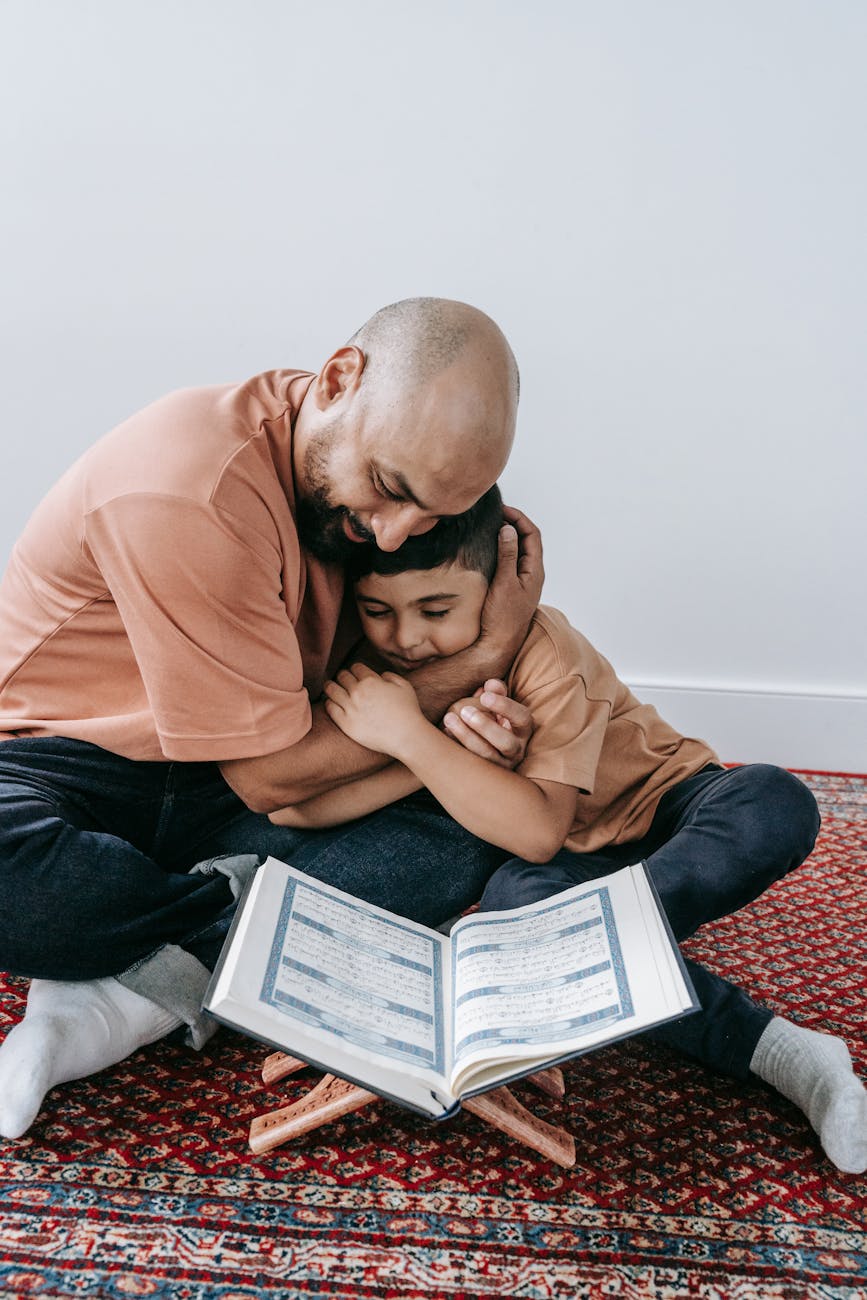 father and son sitting on the floor