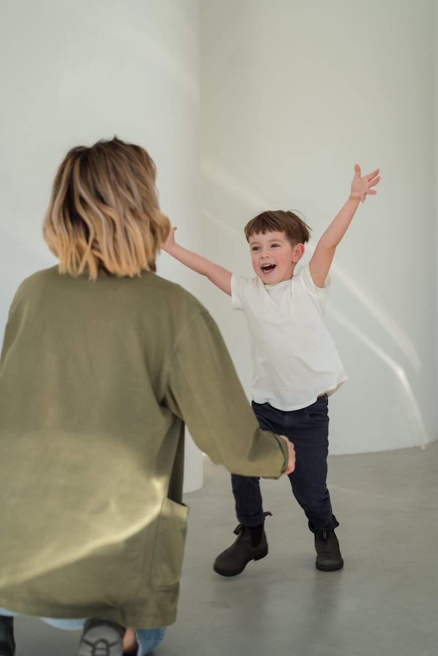 happy boy running with arms outstretched